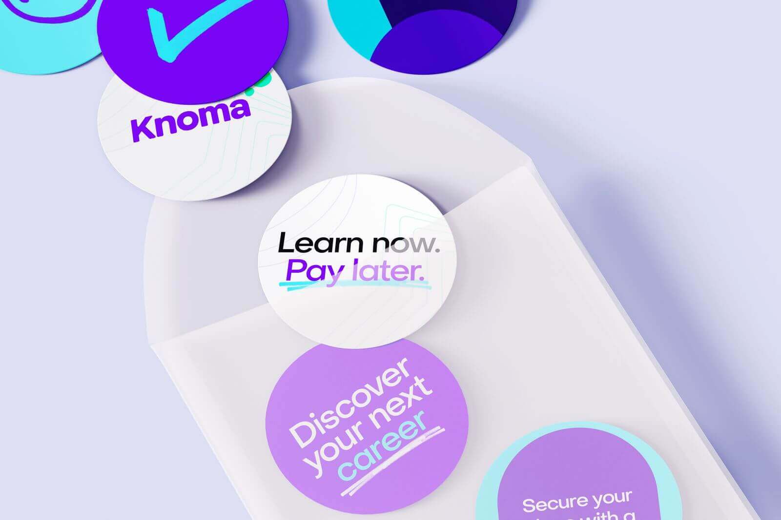 An envelop with stickers falling out, showcasing the Knoma brand.